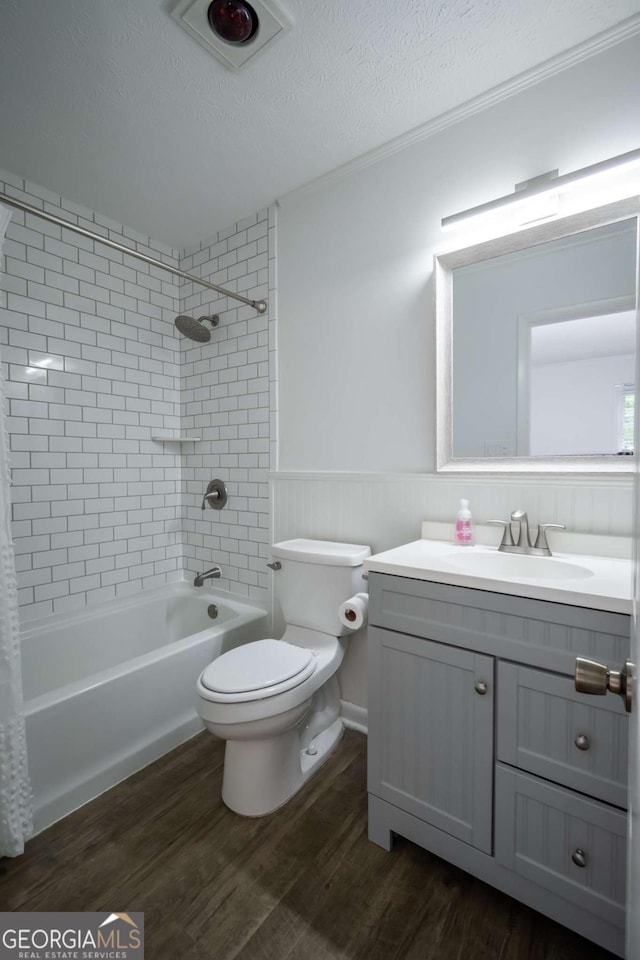 2060 Simonton Bridge Rd, Watkinsville, GA 30677 - full bathroom featuring toilet, vanity, shower / tub combination, wood finished floors, and wainscoting
