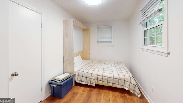 2060 Simonton Bridge Rd, Watkinsville, GA 30677 - unfurnished bedroom with wood finished floors and baseboards