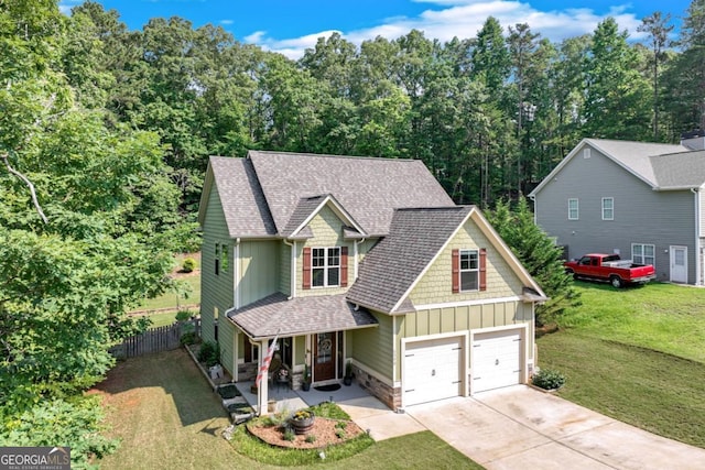 6540 Terracewood Ln, Gainesville, GA 30506 - craftsman house featuring board and batten siding, a porch, concrete driveway, a garage, and a shingled roof