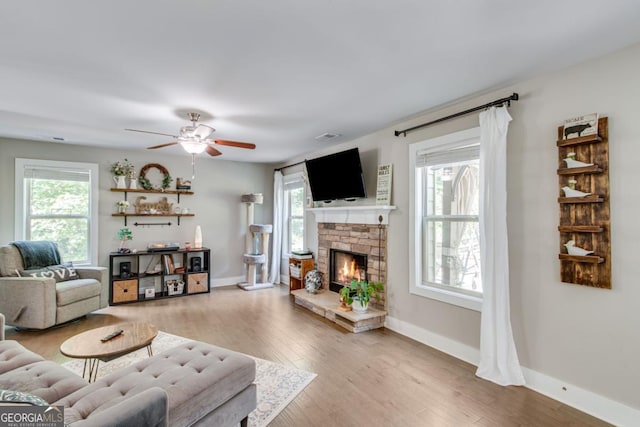 6540 Terracewood Ln, Gainesville, GA 30506 - living room featuring healthy amount of natural light, ceiling fan, wood finished floors, and baseboards