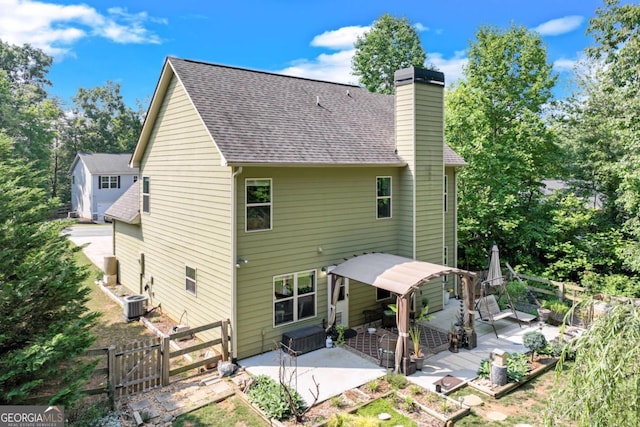 6540 Terracewood Ln, Gainesville, GA 30506 - rear view of property with a patio, a gate, a chimney, a fenced backyard, and a shingled roof