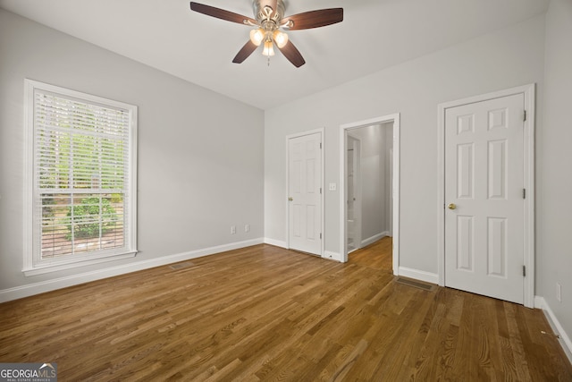 85 Bloomfield Way, Sharpsburg, GA 30277 - unfurnished bedroom featuring baseboards, wood finished floors, and a ceiling fan