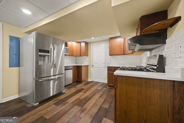 85 Bloomfield Way, Sharpsburg, GA 30277 - kitchen with stainless steel appliances, wall chimney exhaust hood, light countertops, dark wood-style floors, and decorative backsplash