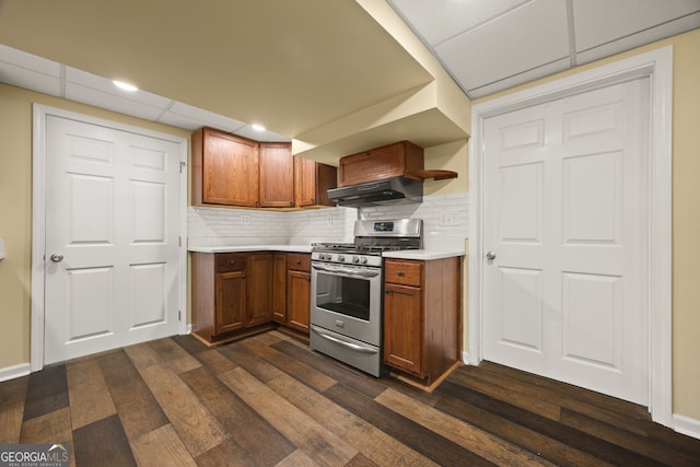 85 Bloomfield Way, Sharpsburg, GA 30277 - kitchen with stainless steel gas range oven, ventilation hood, dark wood-type flooring, and brown cabinets