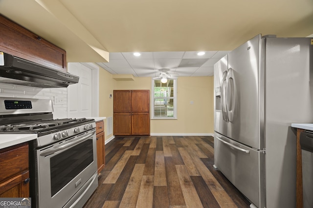 85 Bloomfield Way, Sharpsburg, GA 30277 - kitchen with appliances with stainless steel finishes, premium range hood, light countertops, ceiling fan, and dark wood-style floors