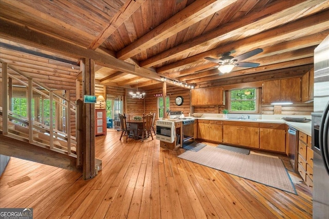 15 Bailey St, Whitesburg, GA 30185 - kitchen featuring white range oven, brown cabinets, light countertops, dishwasher, and rustic walls