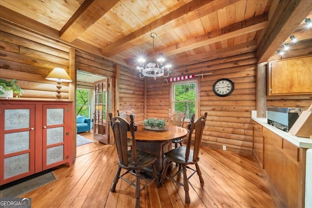 15 Bailey St, Whitesburg, GA 30185 - dining area with wooden ceiling with exposed beams, a chandelier, light wood-style floors, french doors, and log walls