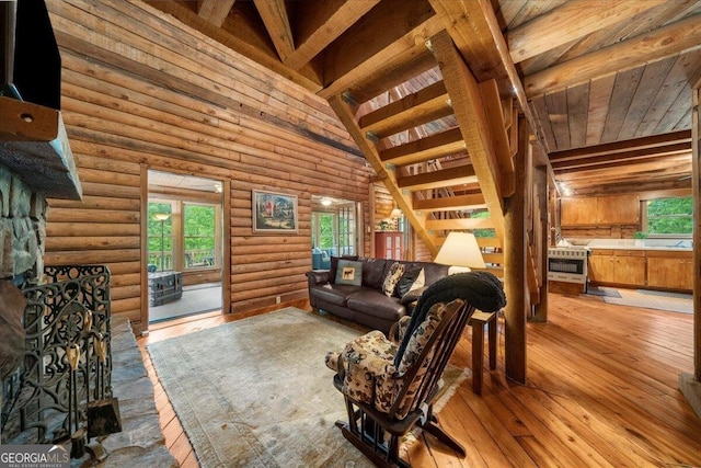 15 Bailey St, Whitesburg, GA 30185 - living room with healthy amount of natural light, wooden ceiling, hardwood / wood-style floors, and log walls