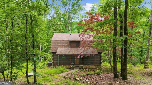 15 Bailey St, Whitesburg, GA 30185 - log home with log exterior, a shingled roof, covered porch, and a wooded view