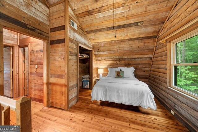 15 Bailey St, Whitesburg, GA 30185 - bedroom featuring vaulted ceiling, wood ceiling, wood walls, and light wood finished floors