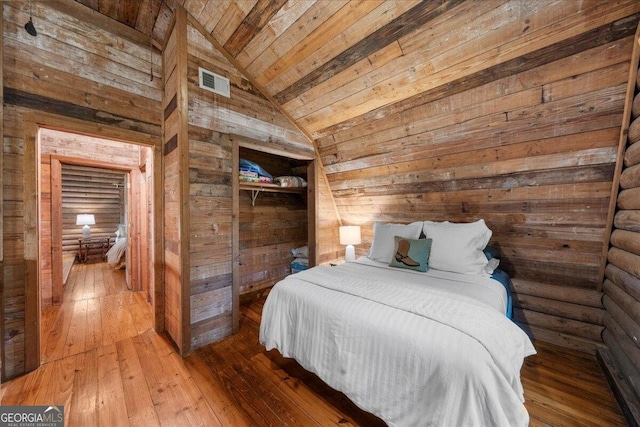 15 Bailey St, Whitesburg, GA 30185 - bedroom featuring wood ceiling, wooden walls, wood-type flooring, and lofted ceiling