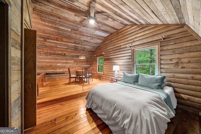 15 Bailey St, Whitesburg, GA 30185 - bedroom with wooden ceiling, lofted ceiling, log walls, and hardwood / wood-style floors