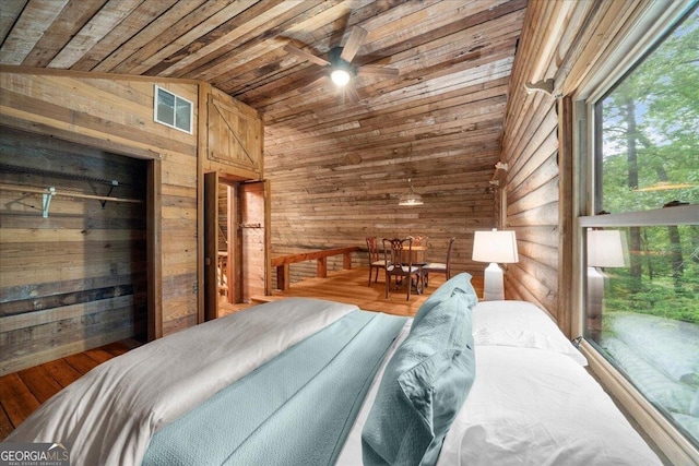 15 Bailey St, Whitesburg, GA 30185 - bedroom with wood ceiling, wood walls, vaulted ceiling, and wood finished floors