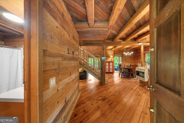 15 Bailey St, Whitesburg, GA 30185 - corridor featuring wood ceiling with exposed beams, wood walls, stairway, heating unit, and a chandelier