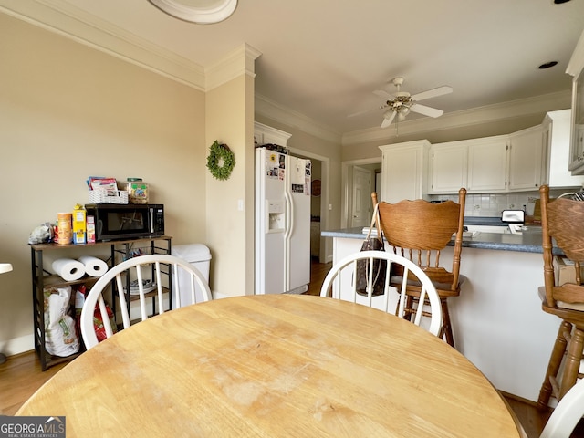 11 Stonegable Dr NW, Rome, GA 30165 - dining area featuring ceiling fan, wood finished floors, and ornamental molding