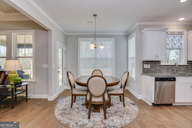 895 Lillian Park Dr, Grovetown, GA 30813 - dining room with a chandelier, light wood finished floors, baseboards, and crown molding
