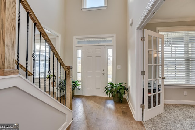 895 Lillian Park Dr, Grovetown, GA 30813 - entrance foyer with ornamental molding, plenty of natural light, stairs, a high ceiling, and wood finished floors