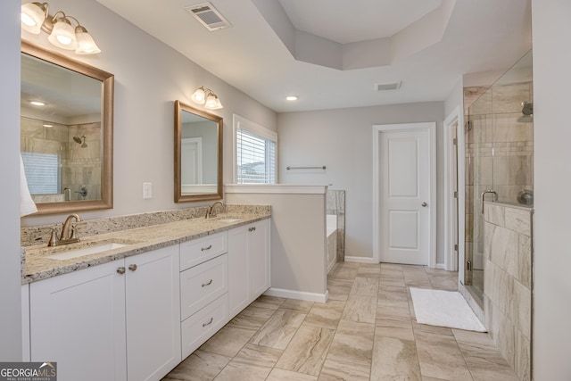 895 Lillian Park Dr, Grovetown, GA 30813 - bathroom with a shower stall, double vanity, a garden tub, baseboards, and marble finish floors