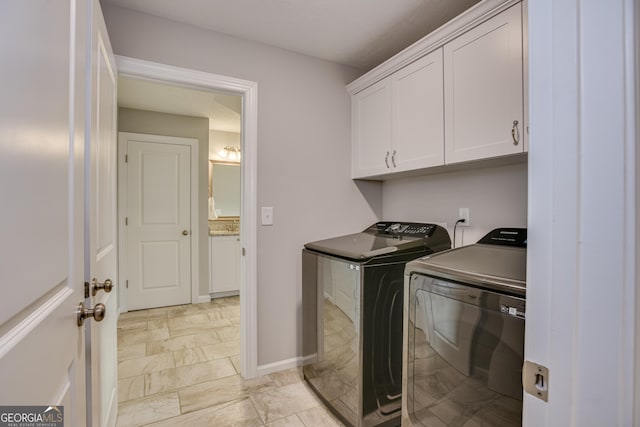 895 Lillian Park Dr, Grovetown, GA 30813 - washroom featuring washing machine and clothes dryer, cabinet space, and baseboards