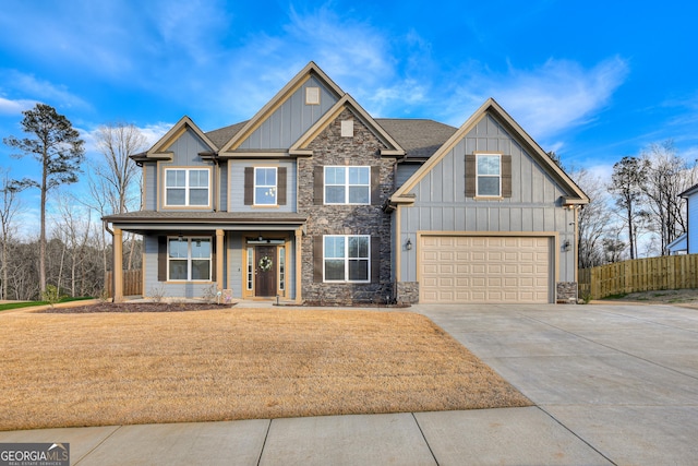 895 Lillian Park Dr, Grovetown, GA 30813 - craftsman house with board and batten siding, stone siding, concrete driveway, a garage, and a porch