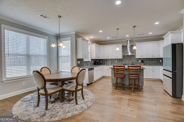 895 Lillian Park Dr, Grovetown, GA 30813 - dining space with ornamental molding, a chandelier, baseboards, recessed lighting, and light wood-type flooring