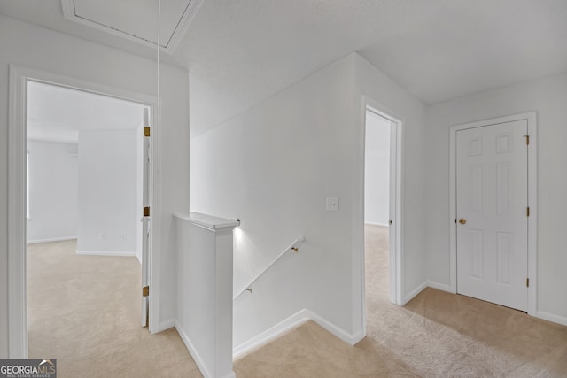 7459 Old Chapel, South Fulton, GA 30349 - hallway featuring an upstairs landing, attic access, and carpet floors