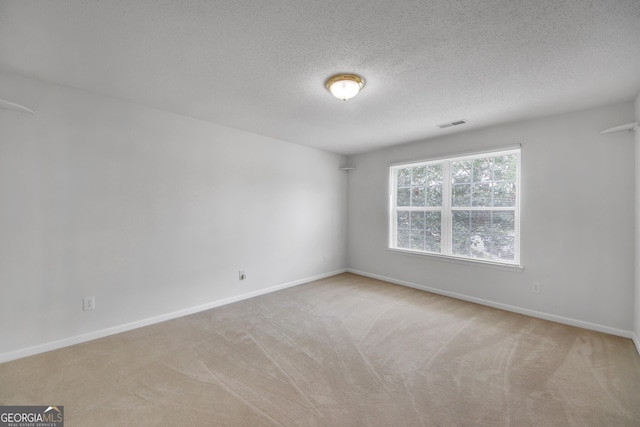 7459 Old Chapel, South Fulton, GA 30349 - carpeted empty room featuring baseboards and a textured ceiling