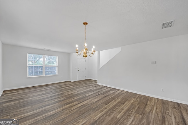 7459 Old Chapel, South Fulton, GA 30349 - unfurnished room with a chandelier and dark wood-type flooring
