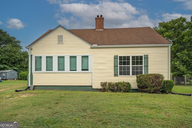 6 Mill St, Jackson, GA 30233 - rear view of property featuring a chimney and a lawn