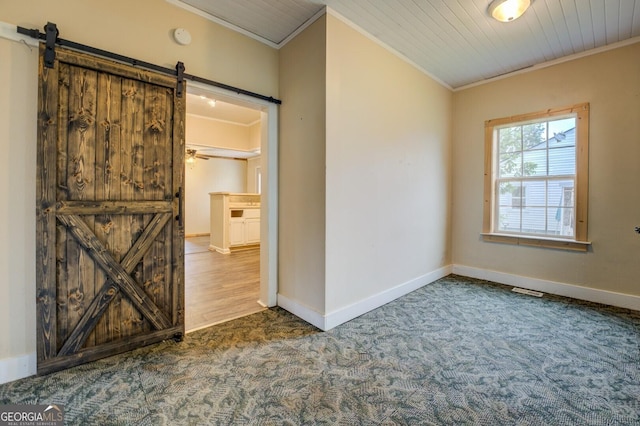 6 Mill St, Jackson, GA 30233 - spare room featuring a barn door, crown molding, carpet floors, baseboards, and a smoke detector