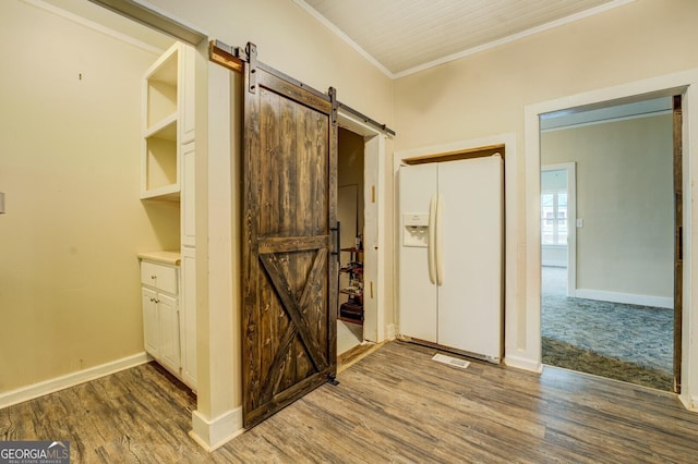 6 Mill St, Jackson, GA 30233 - foyer entrance with a barn door, crown molding, wood finished floors, and baseboards
