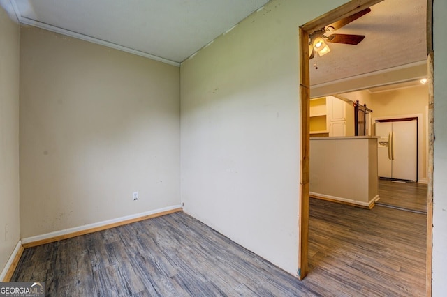 6 Mill St, Jackson, GA 30233 - spare room with crown molding, wood finished floors, ceiling fan, and baseboards