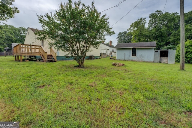 6 Mill St, Jackson, GA 30233 - view of grassy yard with a deck and an outdoor structure