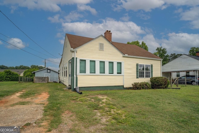 6 Mill St, Jackson, GA 30233 - rear view of house featuring a chimney and a lawn