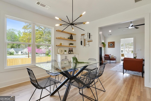 102 Rockyford Rd, Atlanta, GA 30317 - dining area featuring light wood-style flooring, a chandelier, and baseboards
