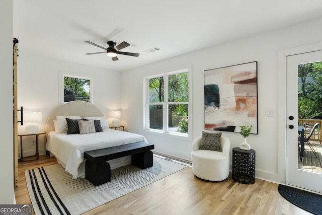 102 Rockyford Rd, Atlanta, GA 30317 - bedroom featuring multiple windows, wood finished floors, access to exterior, and a ceiling fan