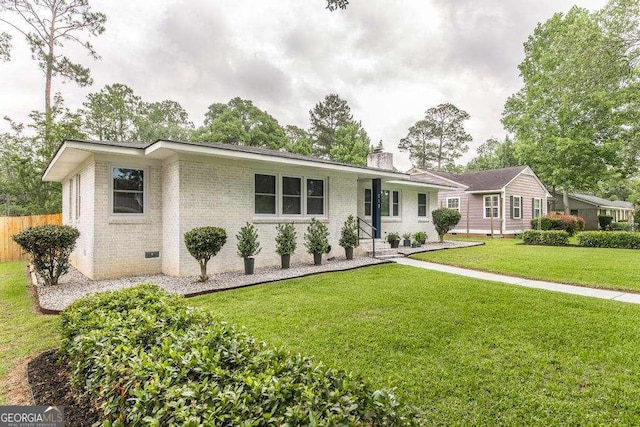 913 7th Ave, Albany, GA 31701 - single story home with a chimney and brick siding