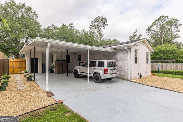 913 7th Ave, Albany, GA 31701 - view of front of home featuring driveway, brick siding, and an attached carport
