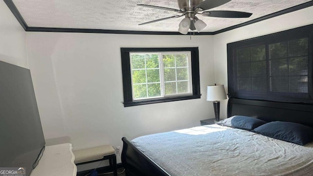2812 Maple Rd SE, Rome, GA 30161 - bedroom with crown molding, a textured ceiling, and a ceiling fan