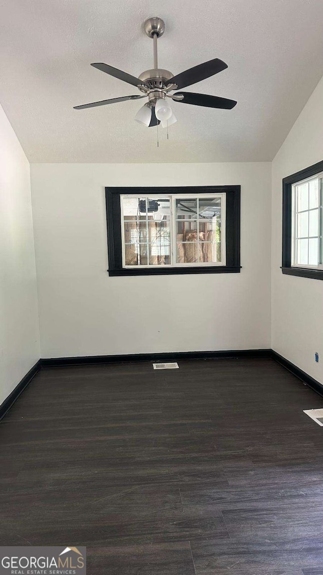 2812 Maple Rd SE, Rome, GA 30161 - spare room featuring wood finished floors, baseboards, a ceiling fan, a textured ceiling, and lofted ceiling