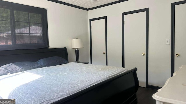 2812 Maple Rd SE, Rome, GA 30161 - bedroom featuring crown molding and dark wood-style floors