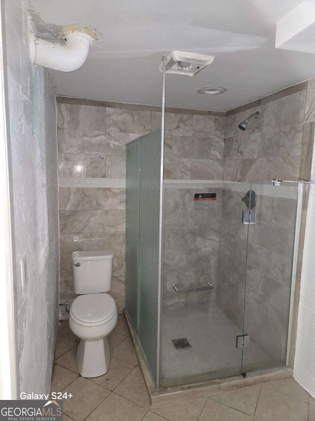 2812 Maple Rd SE, Rome, GA 30161 - bathroom with toilet, a stall shower, and tile patterned floors