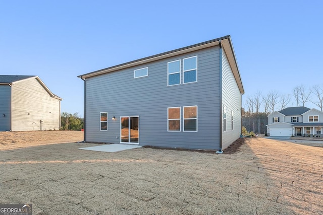 4036 Trimrose Ct Unit 70, Atlanta, GA 30349 - rear view of property featuring a patio and a lawn