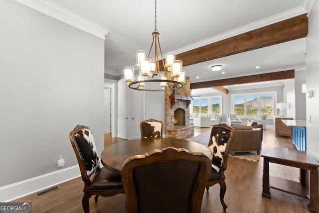 146 David Dr, Tiger, GA 30576 - dining room featuring a chandelier, crown molding, wood finished floors, a fireplace, and recessed lighting