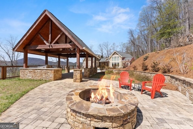 146 David Dr, Tiger, GA 30576 - view of patio featuring an outdoor fire pit, a gazebo, exterior kitchen, and a mountain view