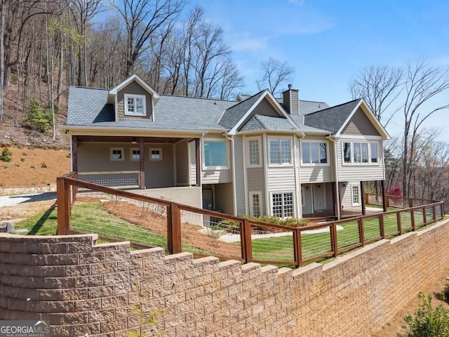 146 David Dr, Tiger, GA 30576 - view of front facade with a fenced front yard, a chimney, and a shingled roof