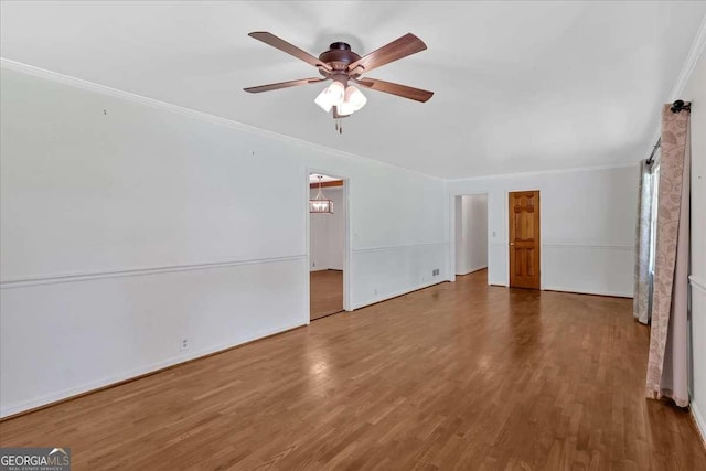 612 Oakcrest Dr, Rockmart, GA 30153 - unfurnished living room featuring crown molding, a ceiling fan, and wood finished floors