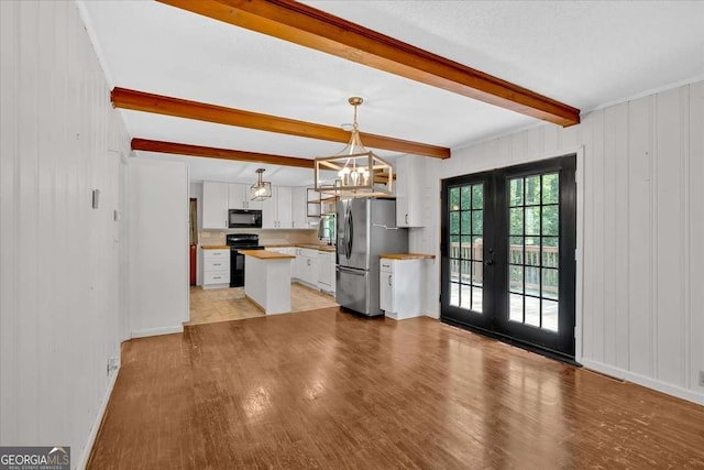 612 Oakcrest Dr, Rockmart, GA 30153 - kitchen with black appliances, beamed ceiling, french doors, light wood-style flooring, and white cabinetry
