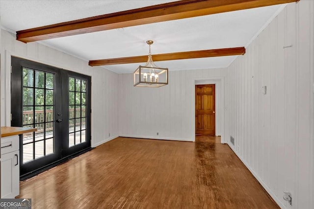 612 Oakcrest Dr, Rockmart, GA 30153 - unfurnished dining area with beam ceiling, wood finished floors, a chandelier, french doors, and baseboards