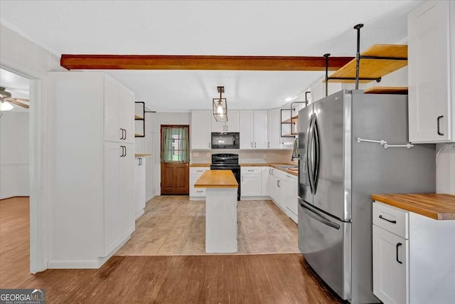 612 Oakcrest Dr, Rockmart, GA 30153 - kitchen with black appliances, wooden counters, light wood-style floors, white cabinets, and beamed ceiling